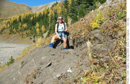 Barb sitting on the edge of a recent huge bear dig