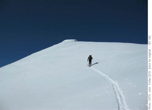 {906 Carl Von} breaking trail towards the summit of Snow Peak
