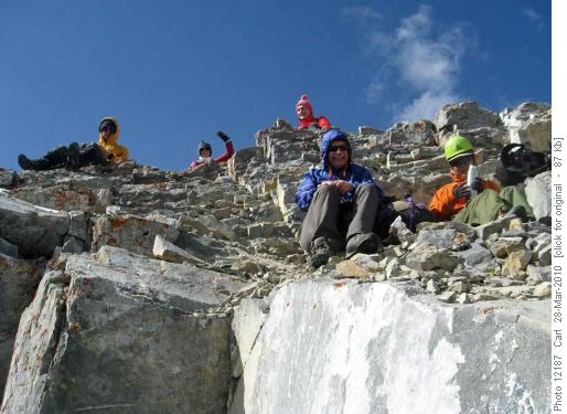 Quick lunch break in some shelter at the summit
