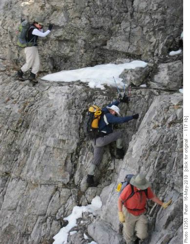 Crux cable on Yam east ridge:Yoko holds cable, Arnold descends amd Nancy continues easily to camera