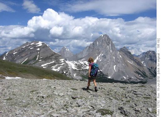Carolyn strides in front of Snow Peak, Mt. Smuts & Birdwood