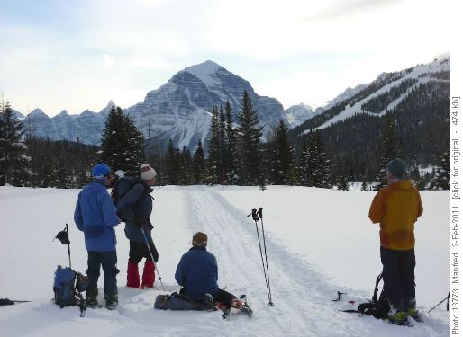 Snowmobile track to Skoki; Mt. Temple in distance
