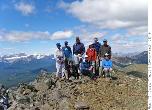 Group at the summit of Lipalian with Mount Niles in the far left skyline