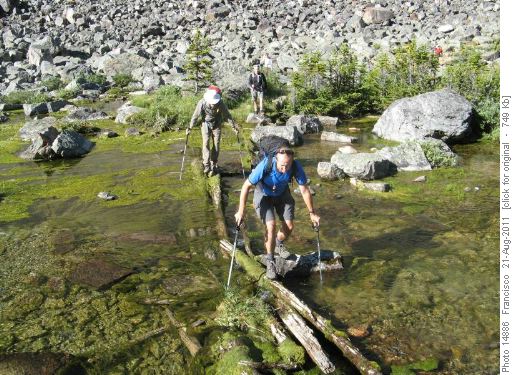 Crossing the lake outlet on slimy logs