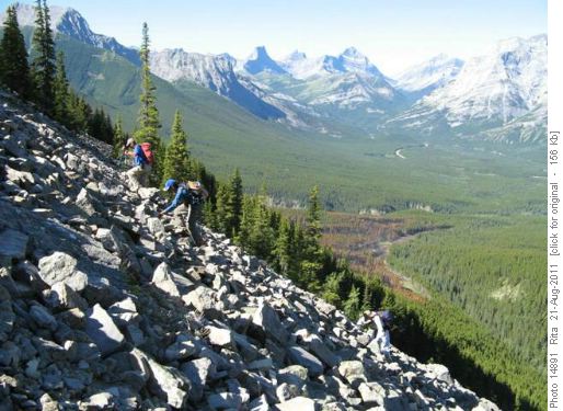scrambling up boulder slope to Volcano peak