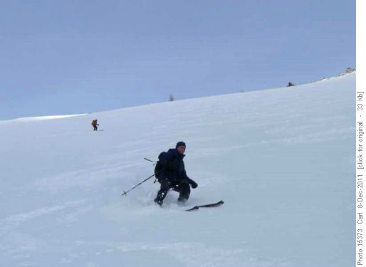 Windpacked slope down from col