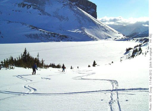 Descent to Ptarmigan with Stuart's group in distance by Redoubt shadow