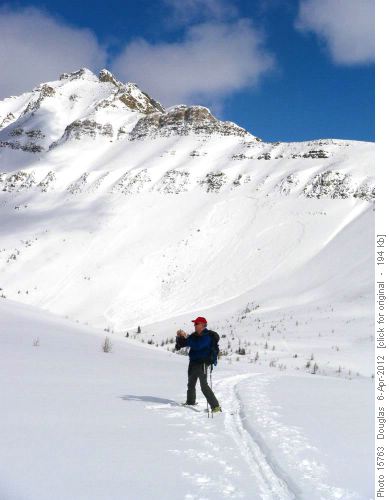 Philip at col with avalanche off Redoubt in background