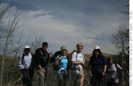 The group posing with John Ware Ridge behind