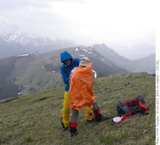 Arnold helping Maria with new raincoat