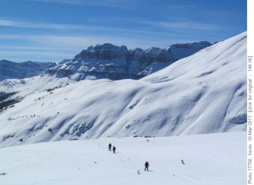 Heading up the slopes with Bow Peak in the distance