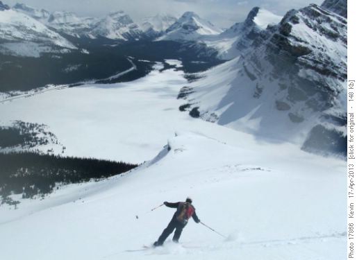 Wallace skiing the upper slopes with Bow Lake below