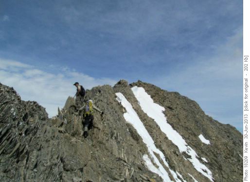 Arnold and Clifton on the ridge with the summit cairn in site