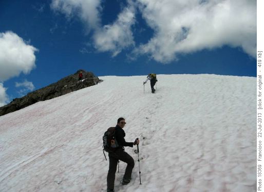 Crossing the snow slope before the final ridge