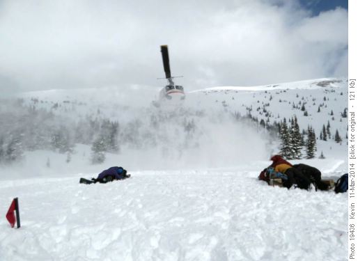 Snow swirl as the chpper lands to pick up the second group
