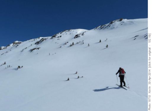 Carl heading up the hard frozen slopes to the ridge