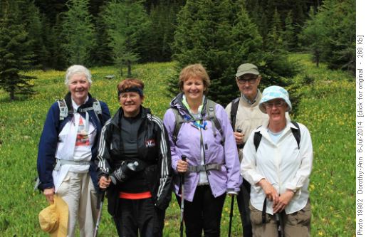 Happy hikers amid the glacier lilies