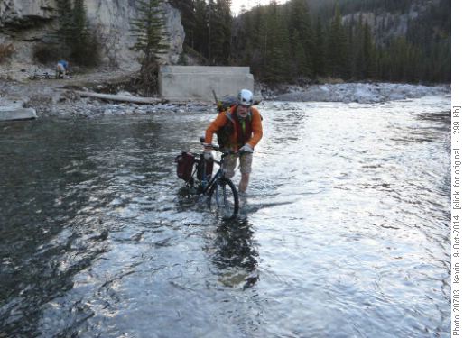 Arnold crossing the very icy Little Elbow river