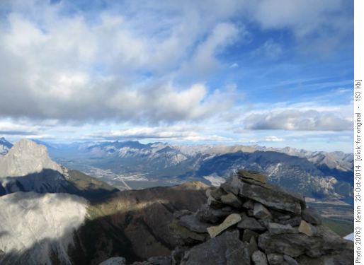 The summit cairn with Canmore to the North