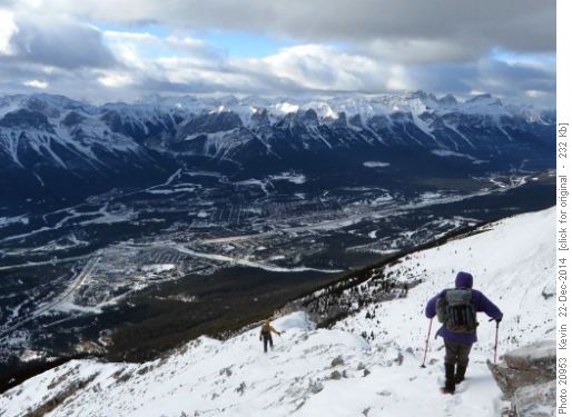 Heading back down the ridge with Canmore below