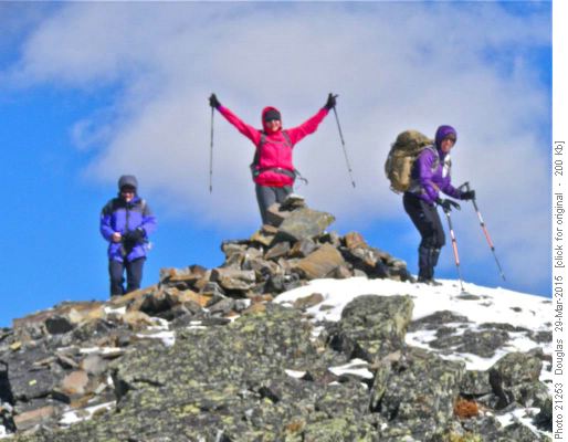 Teresa at the summit with Aldis bracing against the wind.
