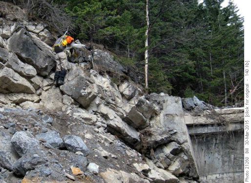 {256 Arnold W} scrambling over the dam