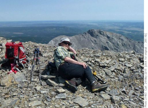 Bill relaxing on Wendell (East Peak in bkg)