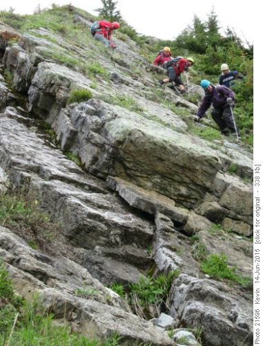 Down climbing slabs on the descent route
