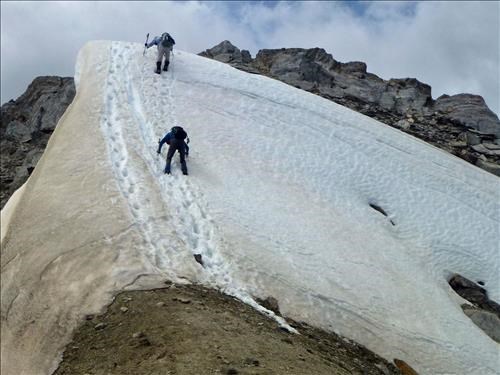 Downclimbing the cornice to get to the north peak