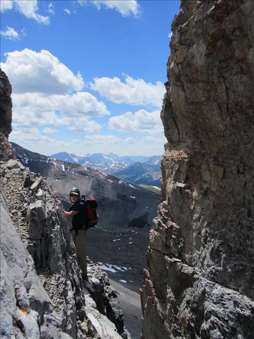 Greg traversing the ledge at the top of the flake