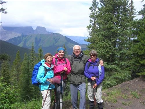 Linda, Teresa, Warren, Aldis with sunny view of Wind Ridge