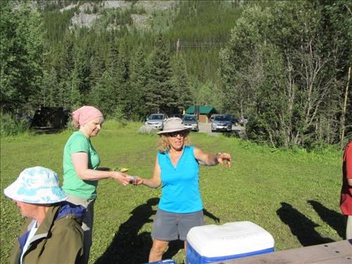 BBQ Boss {466 Ealaine West} points out to {1566 Jane Cary} where she can get grillin'.