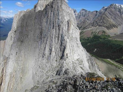 Dennis, Greg & Alda wait before ascending one of the many towers to get over on the ridge