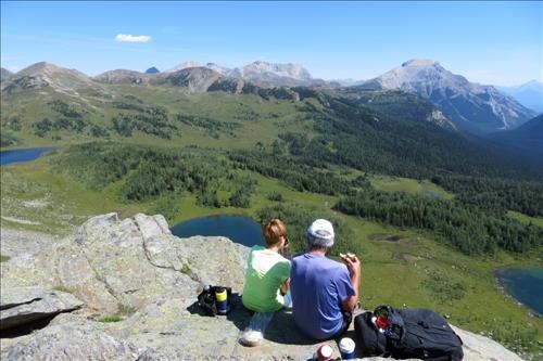 Kathy and Mario having lunch and enjoying the view. Mt. Borgeau and Harvey Pass in the distance