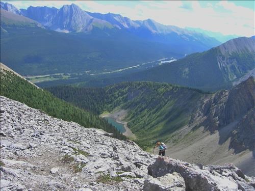 Jennifer ascending 2nd peak with Tryst Lake in background