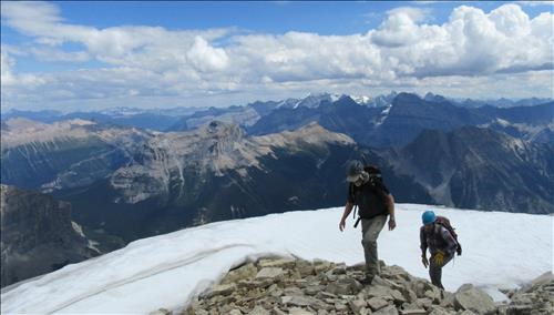 Greg and Brian approaching the summit cairn