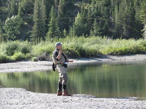 Bill angling on pond below Two Medicine Lake