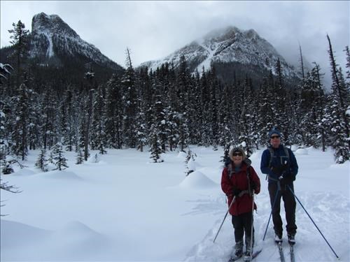 {206 Barb Mitchell} & {154 Philip Creery} pose on Fairview trail with Saddle Mtn & Mt.Fairview behind