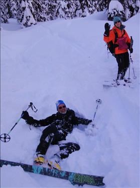 Ed in a hole with Christine cheering him on.