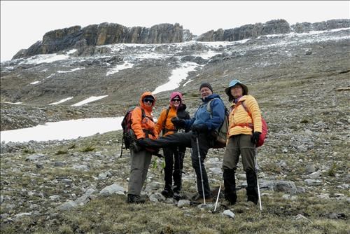 Group shot with Protection Ridge in the background. The clouds lifted just long enough to view our ascent line but we retreated.