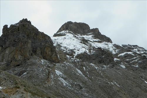 Snow on the slope leading up to the chimney.