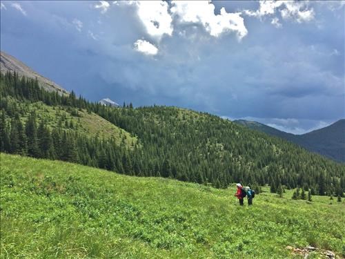 Sue and Carmie looking at some of the storm clouds behind Lineham Peak