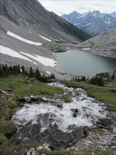 Headwall Creek spewing out of the hillside above the lower lake