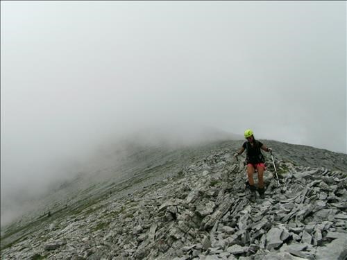 Susan emerging from the clouds on the lower section of the East ridge