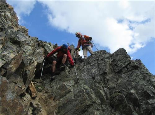 Down climbing the cliff bands on the East side of Unity Peak Down climbing the cliff bands on the East side of Unity Peak