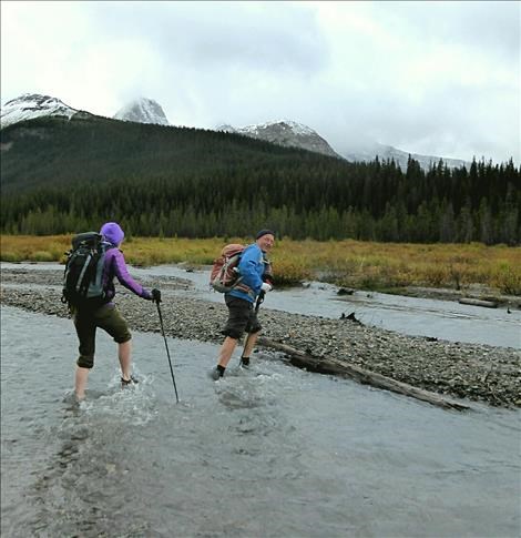 Carl smiling while crossing Smuts Creek.