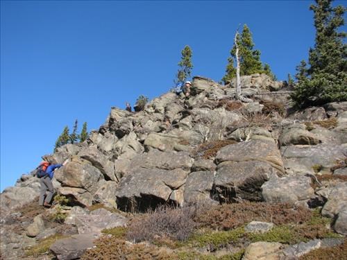 Ramblers scramble up the sandstone hill below Mount Hoffmann