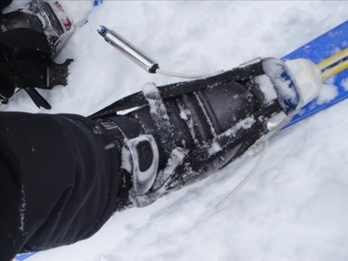 Tele cable repair/substitute on Healy Pass Trail, note strap around toe piece, boot and ankle. 