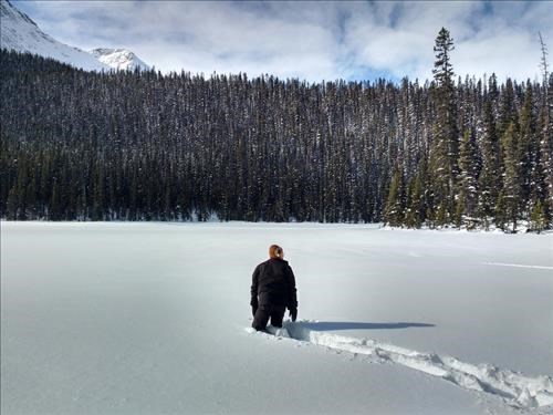 Checking out the snow depth on the lake