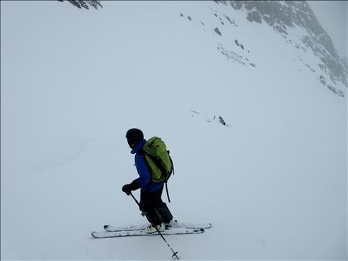 Clifton skiing down from the col in flat light